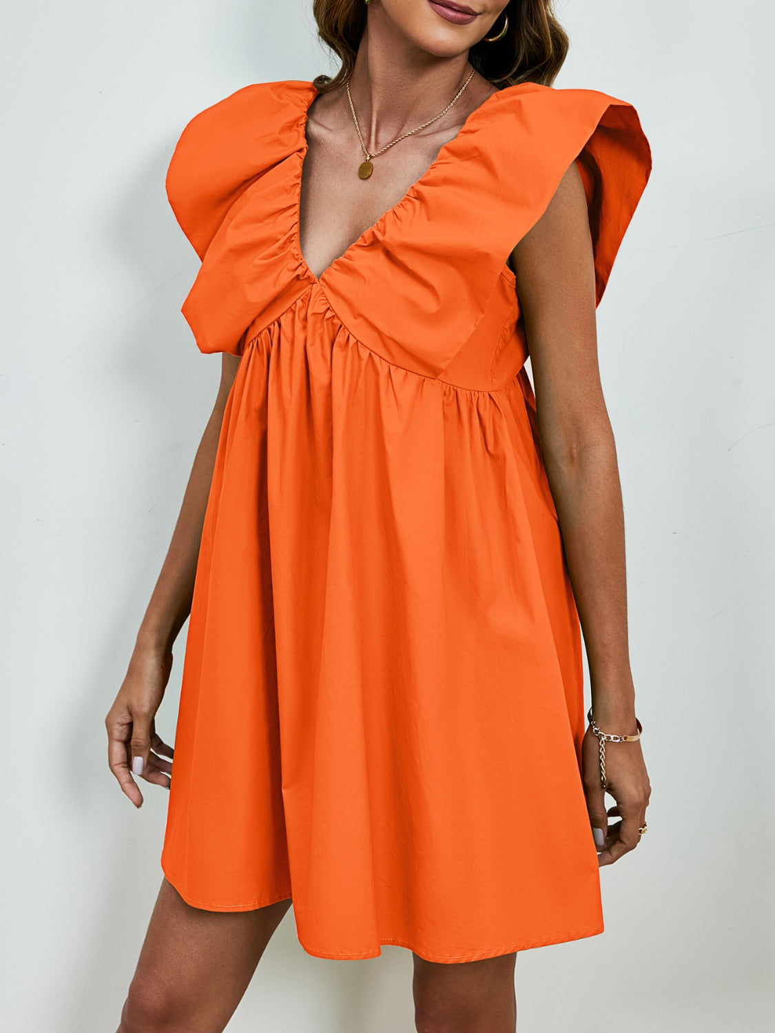BELLA V-neck cap sleeve mini dress from Trendsi, featuring a stylish V-neckline and fitted cap sleeves, perfect for casual or dressy occasions.