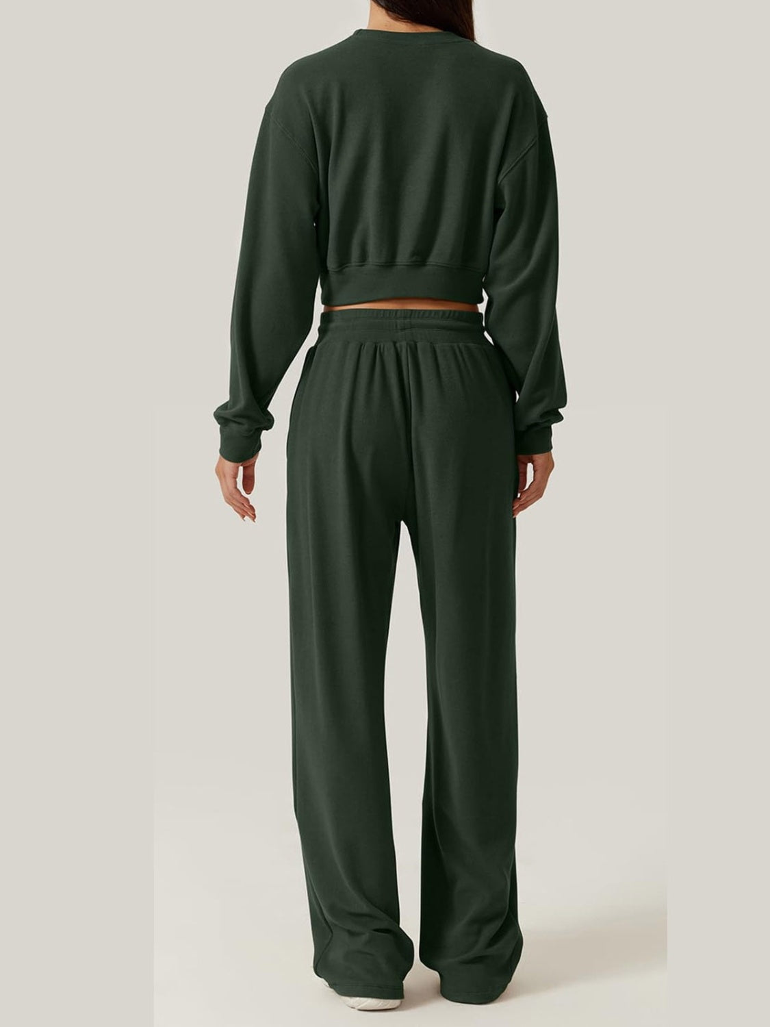 BELLA Trendsi crisscross round neck top and drawstring pants set, featuring a stylish matching outfit with a relaxed fit.