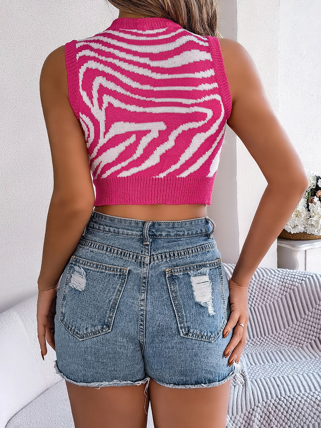 BELLA BLA trendy cutout animal print round neck tank top with sleeveless design and bold pattern, perfect for casual wear.