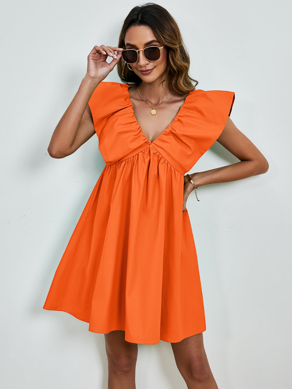 BELLA V-neck cap sleeve mini dress featuring a fitted silhouette and stylish design, perfect for casual or semi-formal occasions.