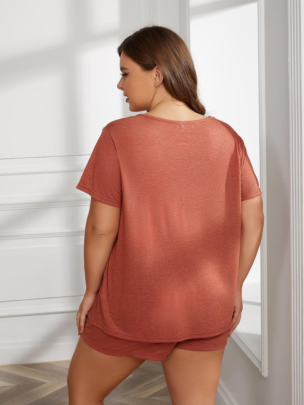 Plus size two-piece loungewear set by BELLA, featuring a comfortable top and matching pants, perfect for relaxed casual wear.