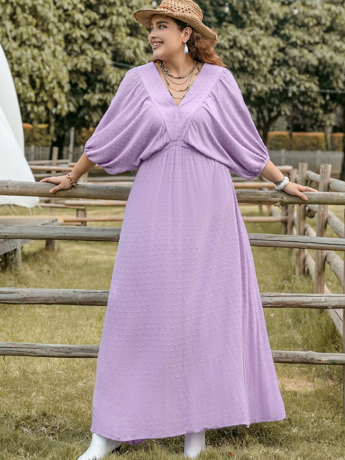 Plus size BELLA Swiss Dot V-Neck midi dress featuring a flowy silhouette and delicate dot pattern, ideal for stylish occasions.