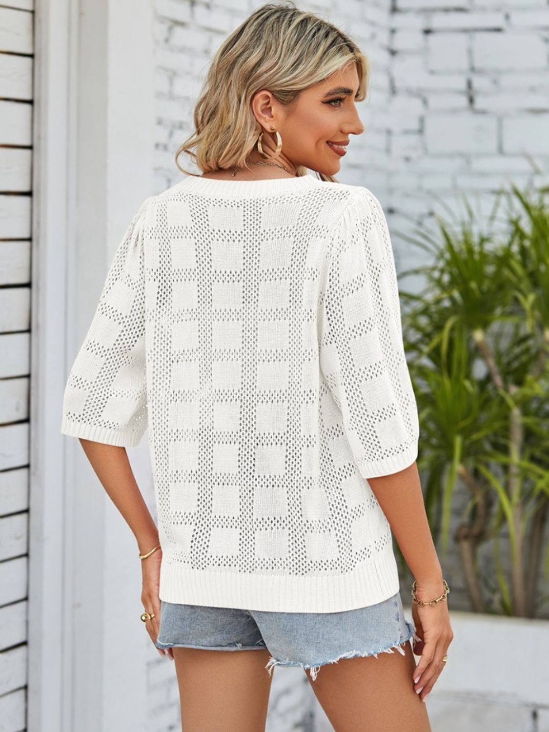 BELLA openwork round neck knit top featuring a stylish, lightweight fabric with intricate openwork pattern and a classic round neckline.
