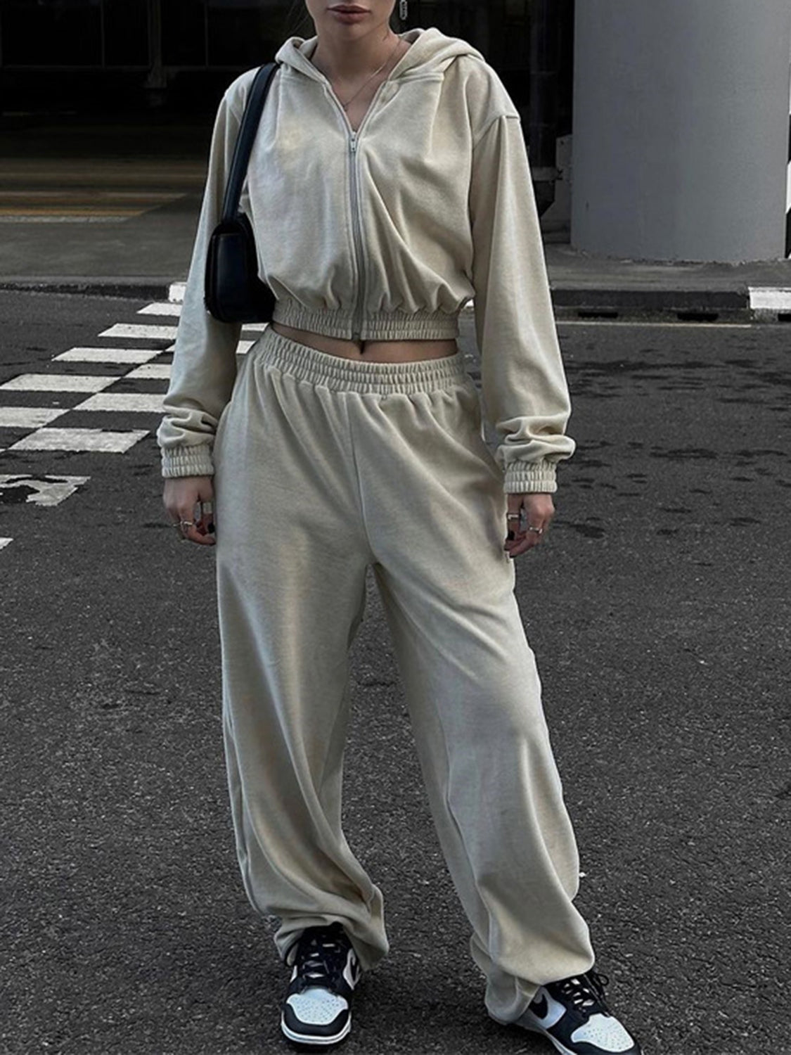 BELLA BLA Zip Up Hoodie and Pocketed Pants Set in trendy matching fabric, with hoodie featuring a front zipper and side pockets.