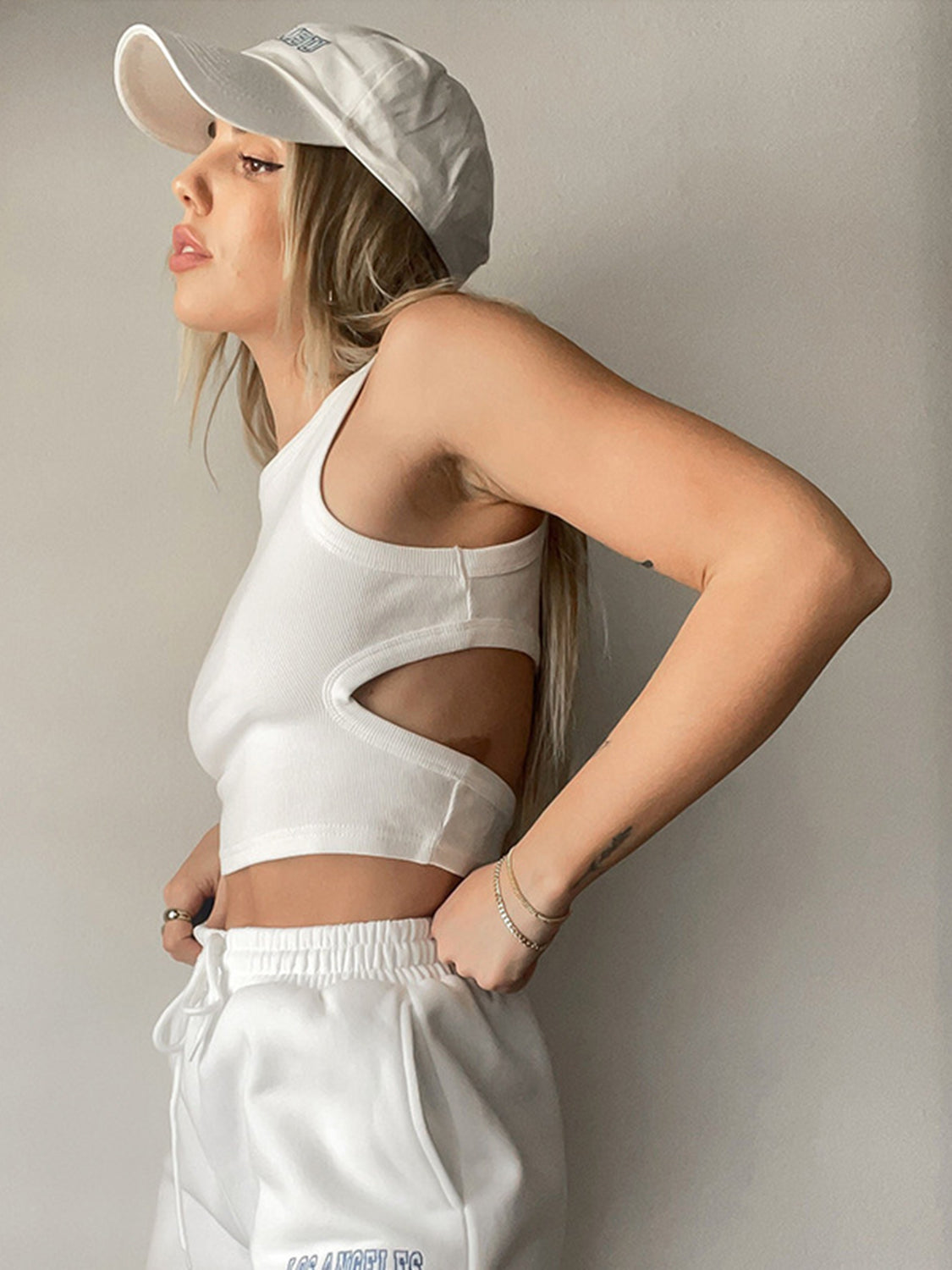 BELLA BLA trendsi cutout round neck tank top in neutral fabric, featuring a stylish round neckline and subtle cutout design.