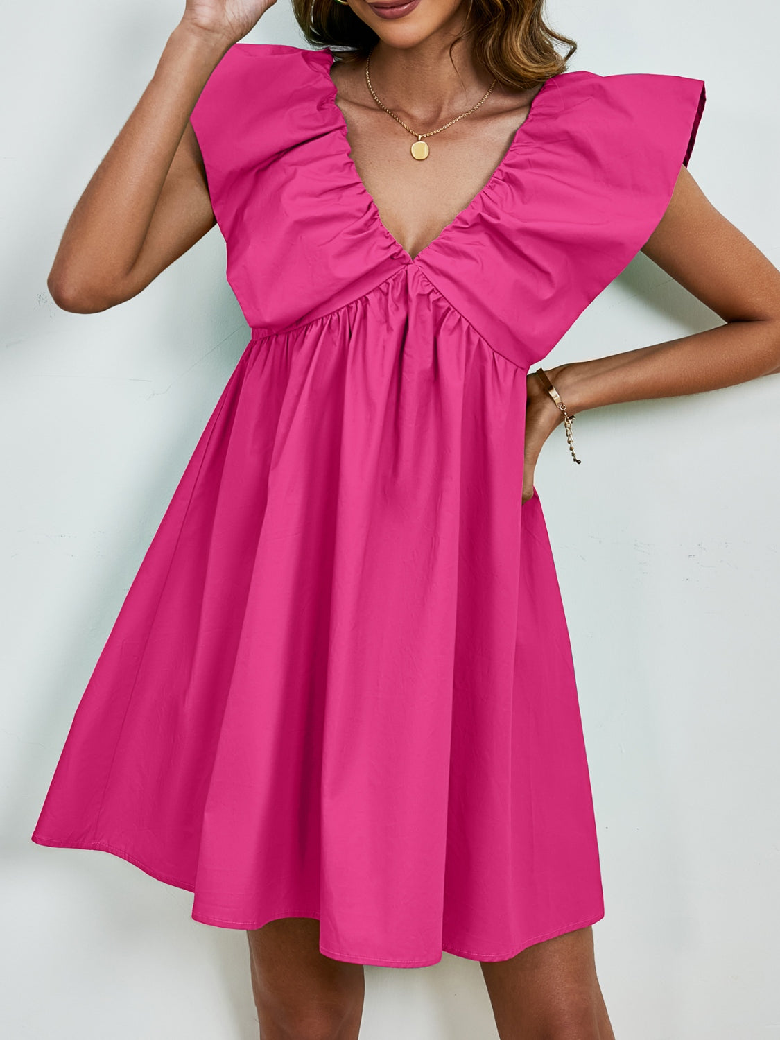 BELLA V-neck cap sleeve mini dress from trendsi, featuring a fitted silhouette and stylish V-neck design.