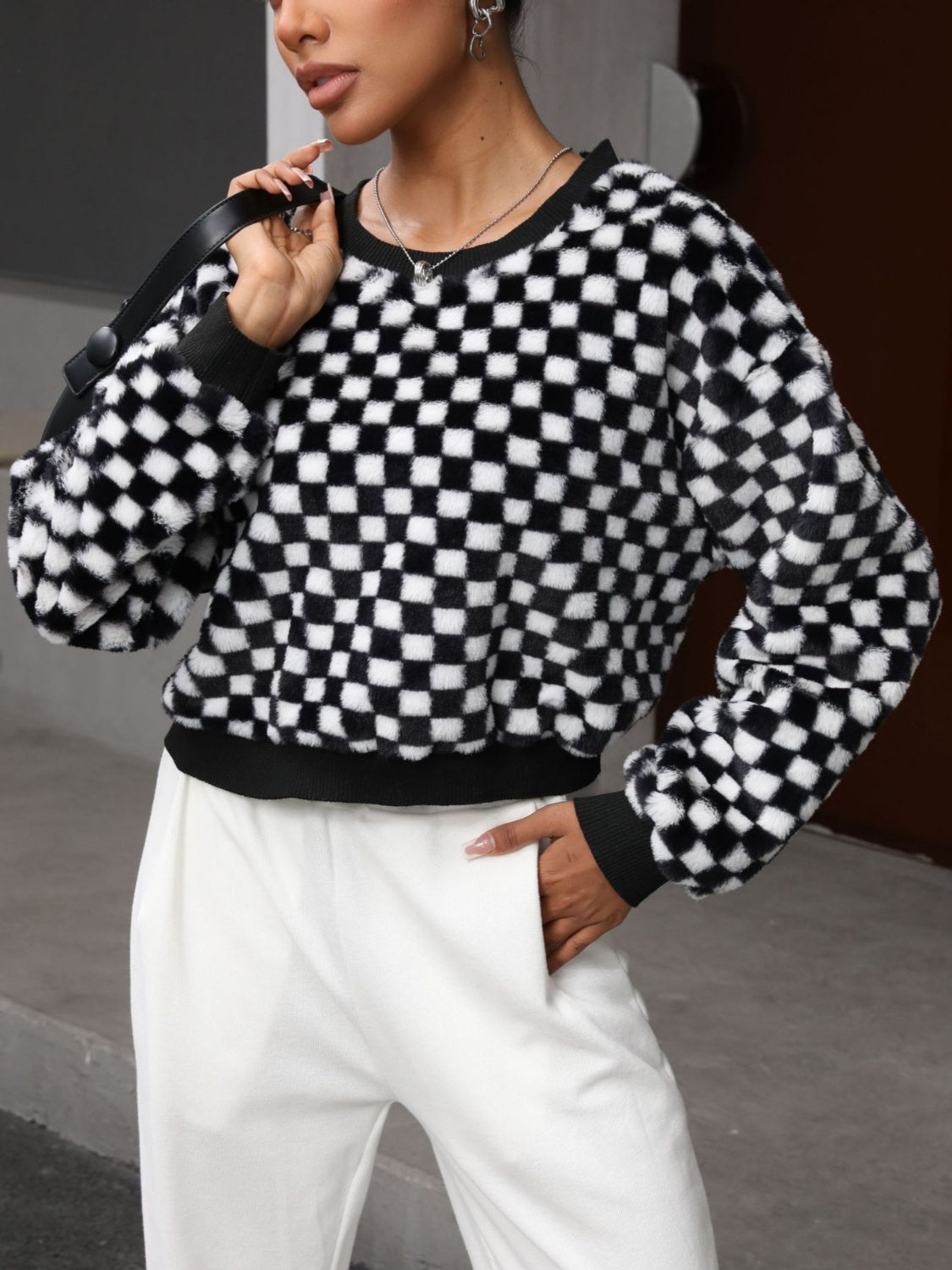 BELLA plaid round neck long sleeve sweater with a cozy, stylish design, featuring a classic plaid pattern and a comfortable fit.