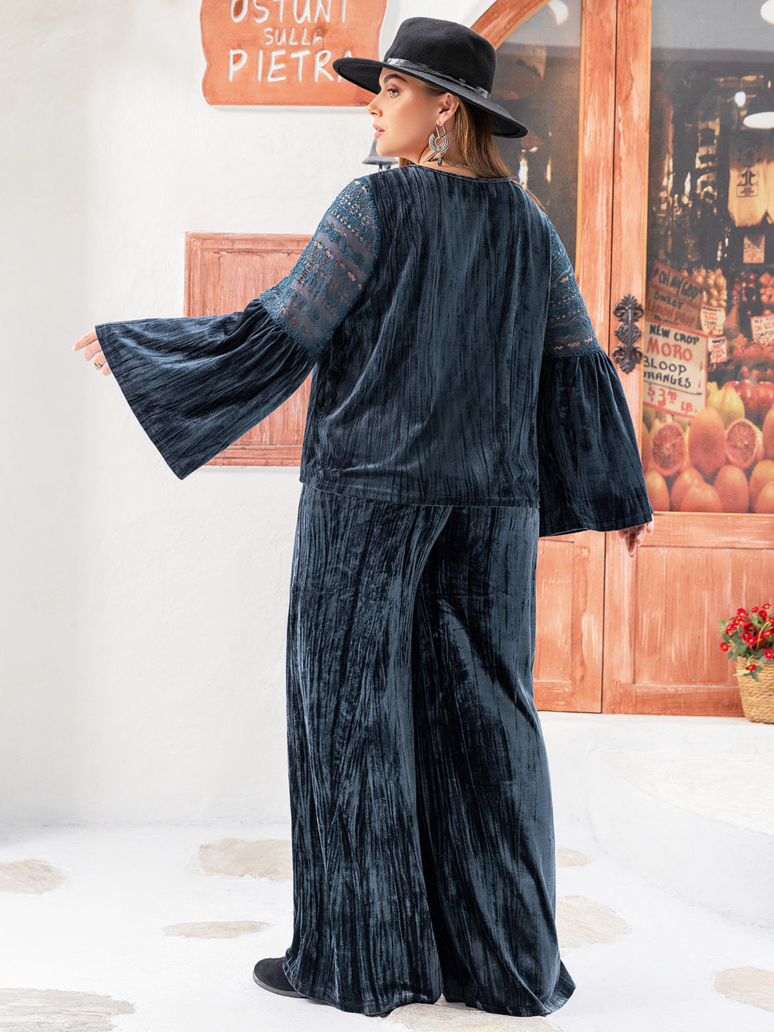 Plus size BELLA flare sleeve top and pants set with round neck, casual style, shown on a model.