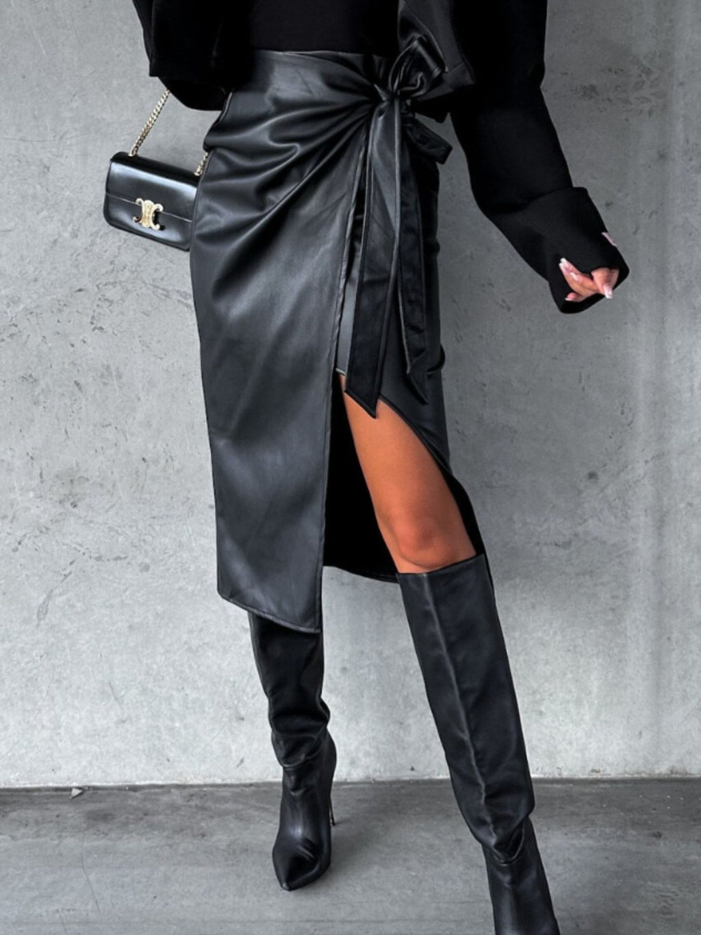 BELLA tied high waist skirt from trendsi, featuring a stylish design with a tied waist and high-rise fit, shown in the image.