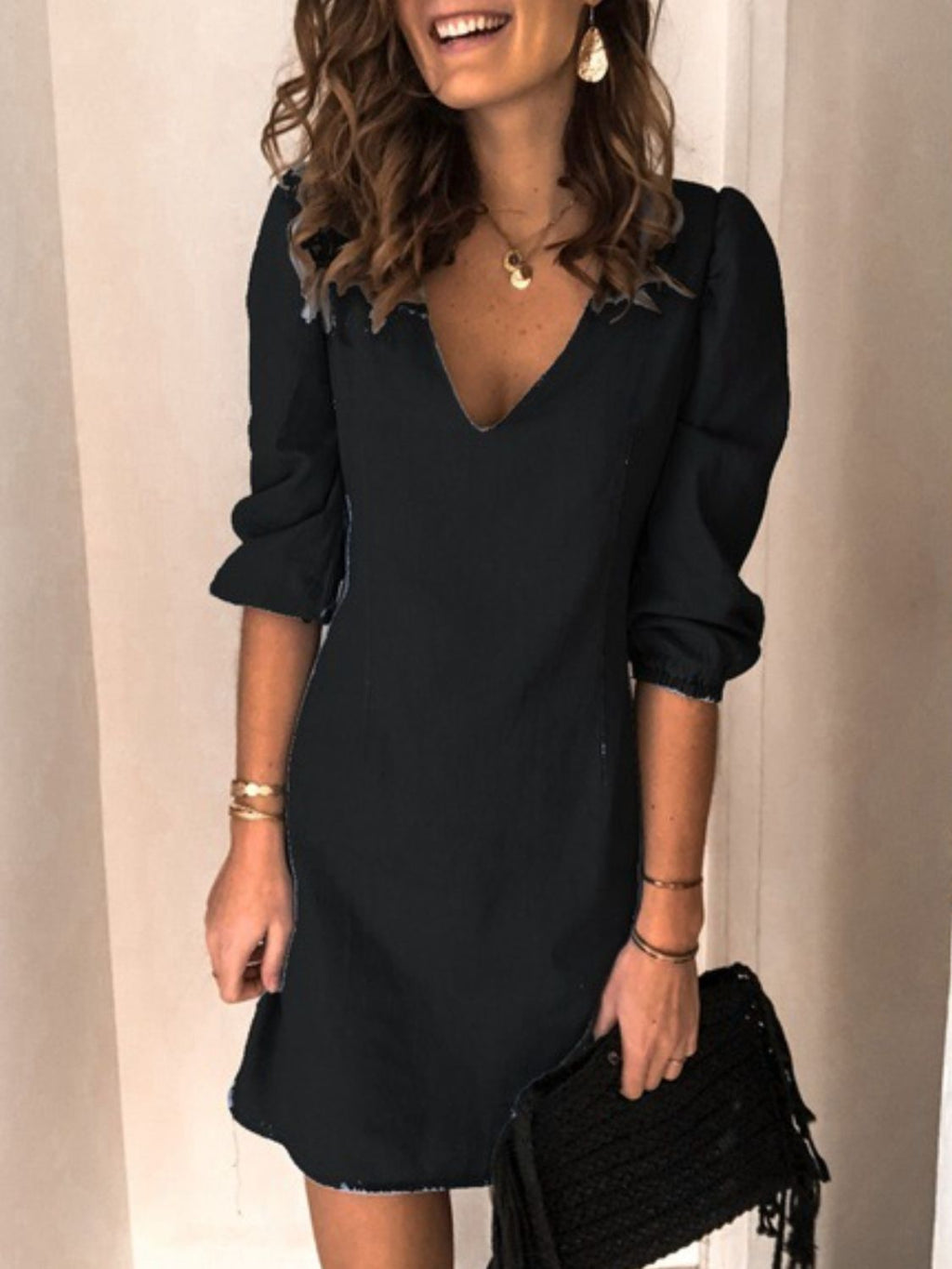 BELLA trendsi full size v-neck half sleeve dress displayed on a mannequin, showcasing its stylish design and comfortable fit.