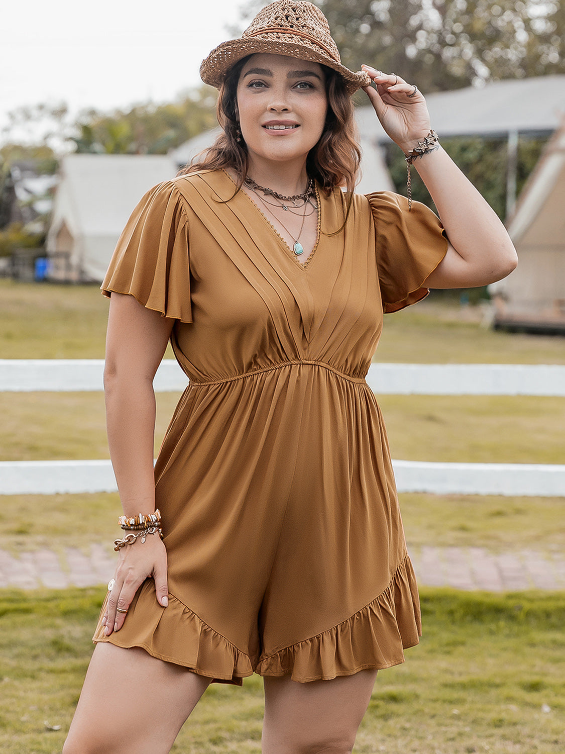 Plus size BELLA ruffled V-neck short sleeve romper, stylish and comfortable, featuring a flattering fit and feminine ruffle details.