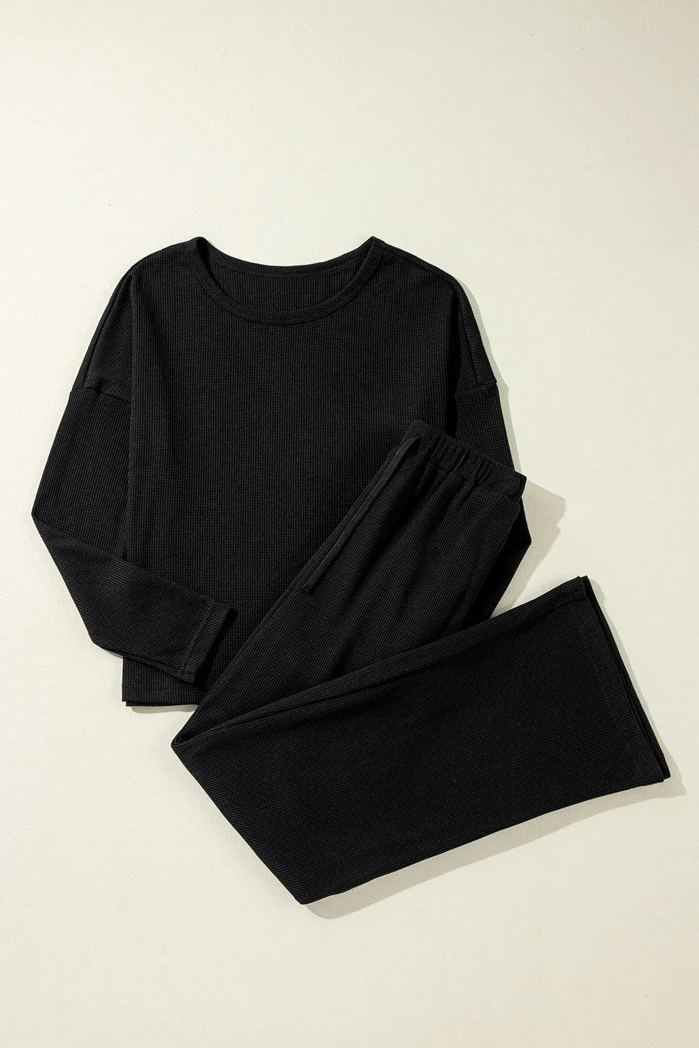 Bella Bla lounge set featuring a stylish top and drawstring pants in soft, comfortable fabric for relaxed wear.