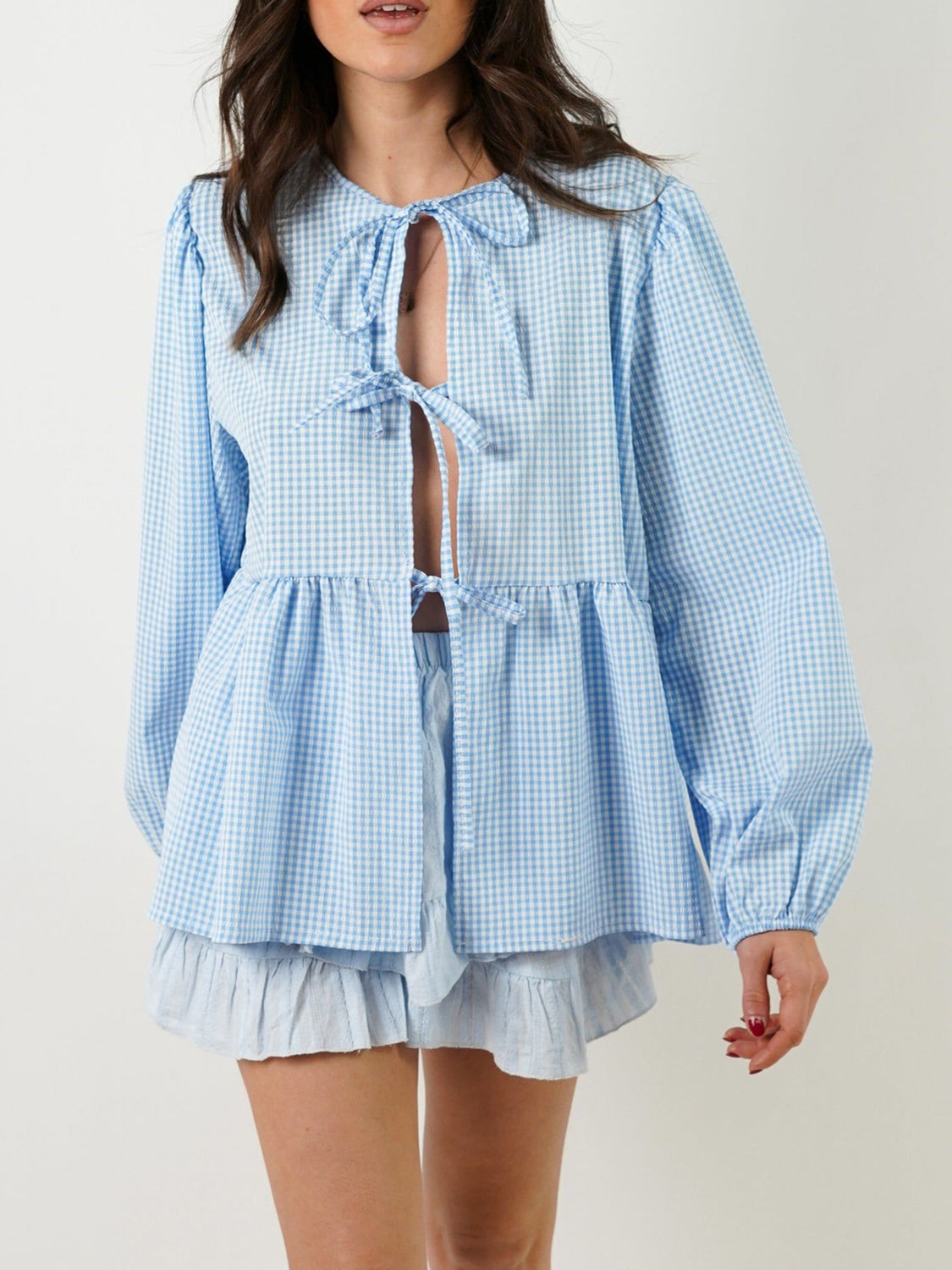 BELLA BLA Tied Round Neck Long Sleeve Blouse in a soft fabric, featuring a front tie detail and a classic round neckline.