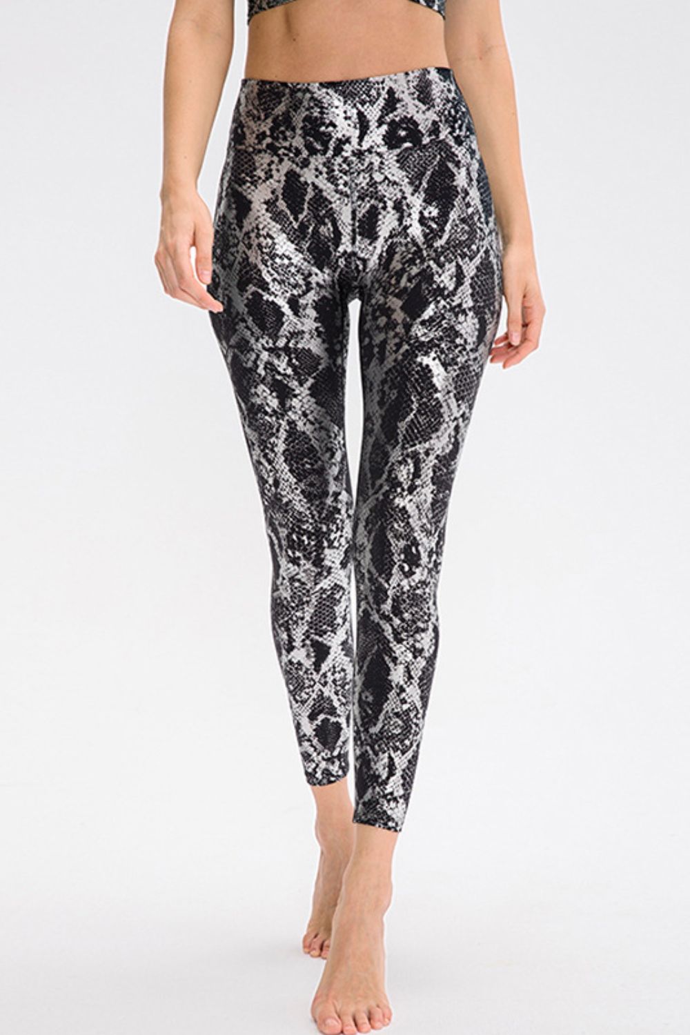 BELLA Print Sports Pants from Trendsi featuring a stylish pattern, comfortable fit, perfect for active or casual wear.
