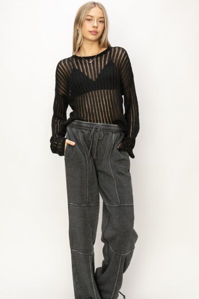 BELLA ribbed long sleeve knit top with fitted design, featuring textured ribbed fabric and a classic crew neckline.