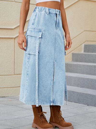 BELLA slit pocketed high waist denim skirt featuring front slit, classic blue wash, and belt loops, styled for casual wear.