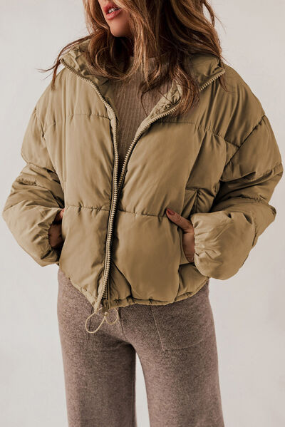 BELLA trendsi puff jacket in black with a high collar and quilted design, lightweight and stylish for cold weather.