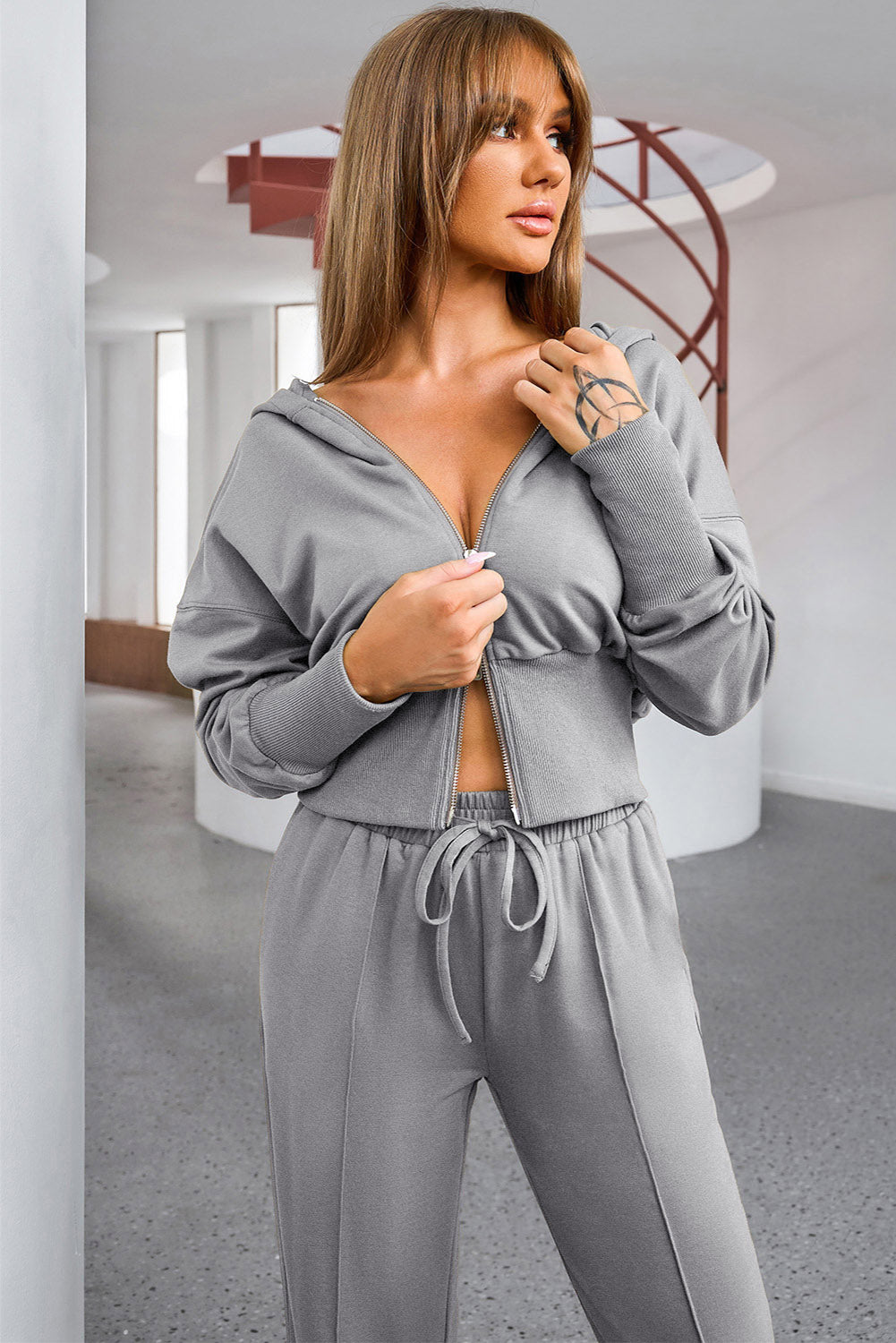 BELLA dropped shoulder hoodie and drawstring pants active set featuring a relaxed fit, soft fabric, and casual style.