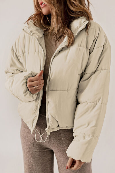 BELLA Puff Jacket from Trendsi, stylish quilted winter coat with a fitted silhouette and high collar, perfect for cold weather.