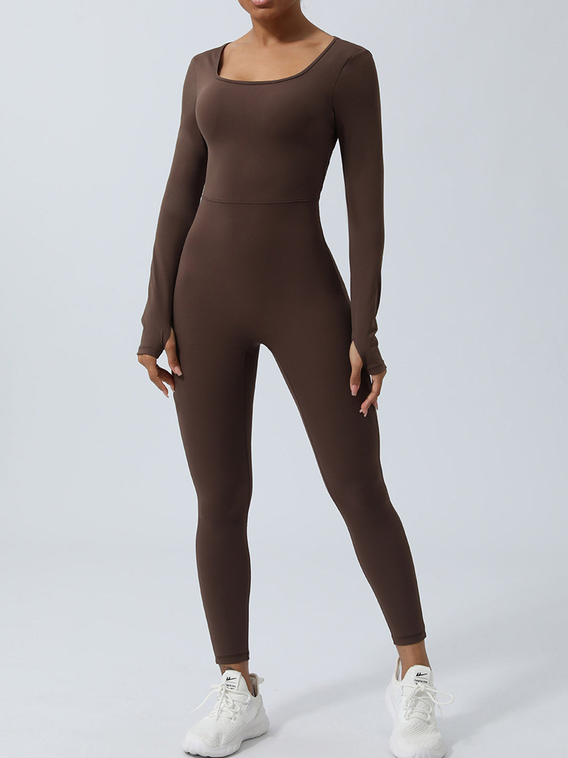 BELLA twisted backless long sleeve jumpsuit from trendsi, featuring a fitted silhouette and stylish design, shown on a model.