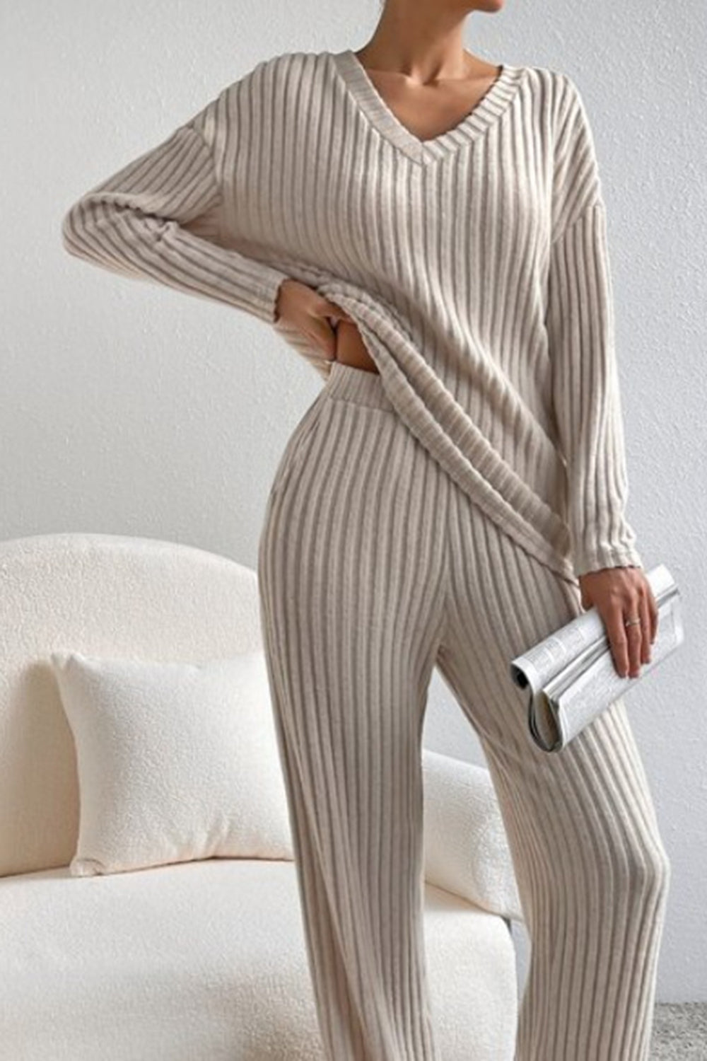 Ribbed V-neck top and matching pants set by Bella BLA, featuring a trendy, fitted design in soft ribbed fabric.