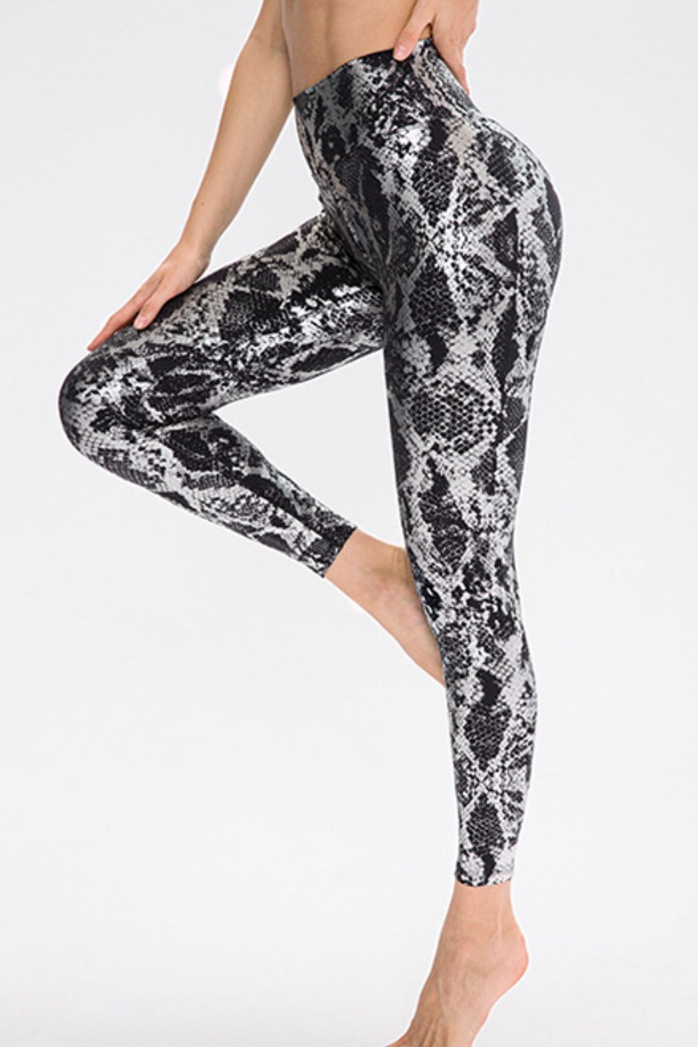 BELLA Print Sports Pants from Trendsi featuring bold patterns and comfortable athletic fit, ideal for active wear.