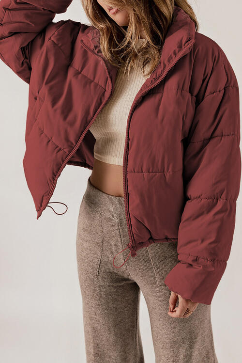 BELLA trendsi puff jacket in black, featuring a quilted design and cozy fit, perfect for cold weather.