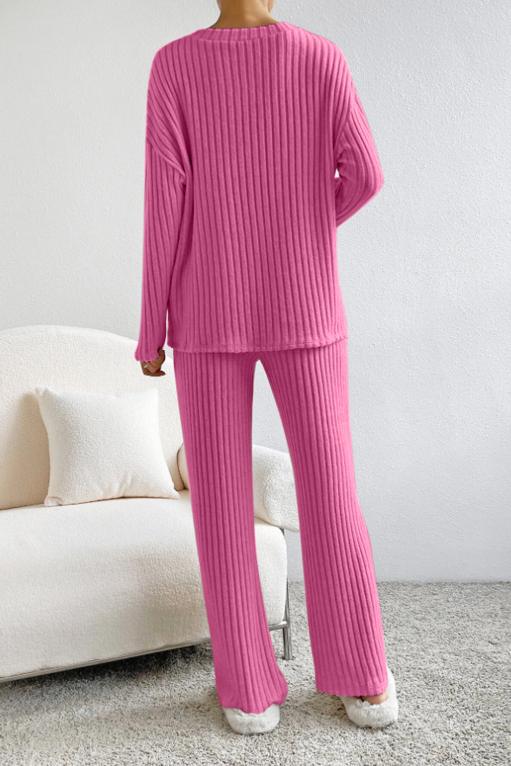 Ribbed V-neck top and pants set by BELLA BLA featuring a matching, textured fabric in a trendy, comfortable style.