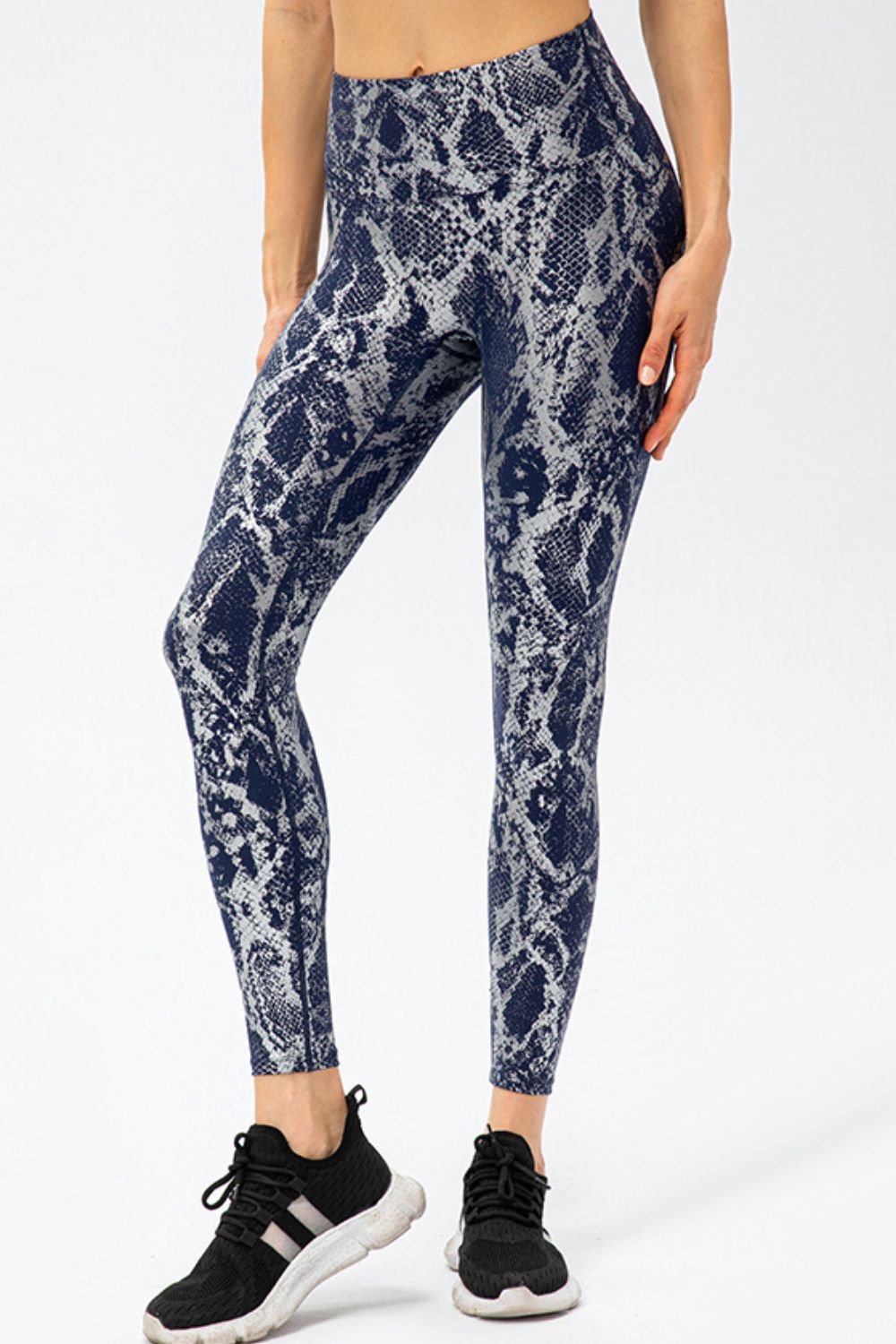 BELLA Print Sports Pants from Trendsi featuring bold pattern design and comfortable fit, perfect for active or casual wear.
