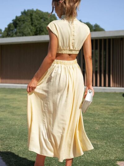 BELLA BLA sleeveless dress with a cutout mock neck, trendy and stylish, shown in a close-up view highlighting the neckline and fabric.
