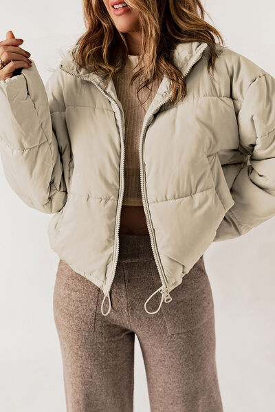 Black BELLA Puff Jacket from Trendsi, featuring a stylish padded design and front zipper, perfect for cold weather.
